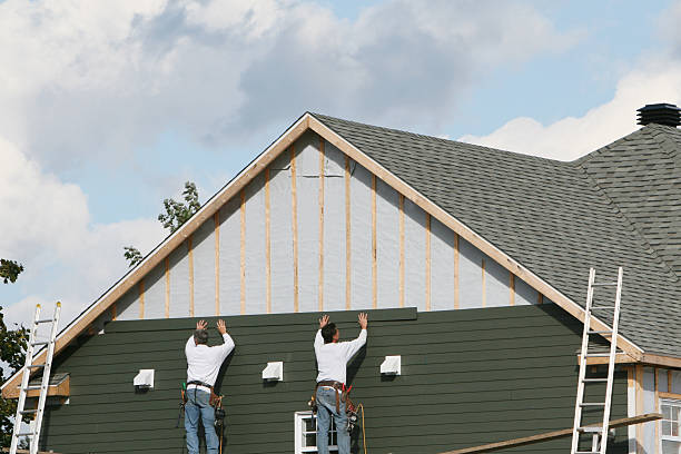 Professional Storm Damage Siding Repair technician working in Bainbridge, OH